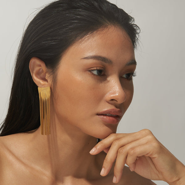 Salita Matthews model wearing the Diah Gold Tassel Earrings