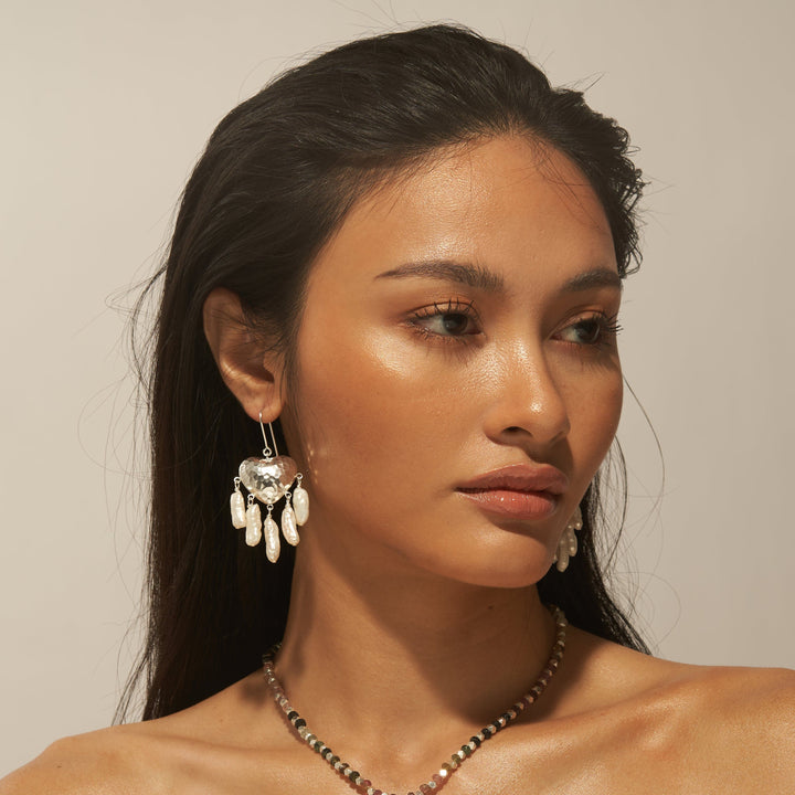 Salita Matthews model wearing the Gold Zainab Pearl Heart Earrings